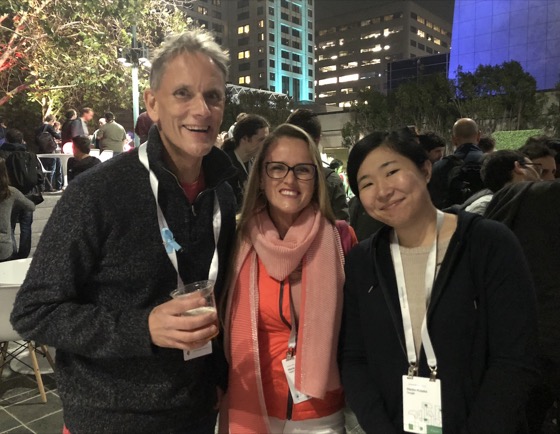 Three dev relations developers together at a conference